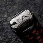 Compact Titanium Gravity‑Deploy Utility Cutter