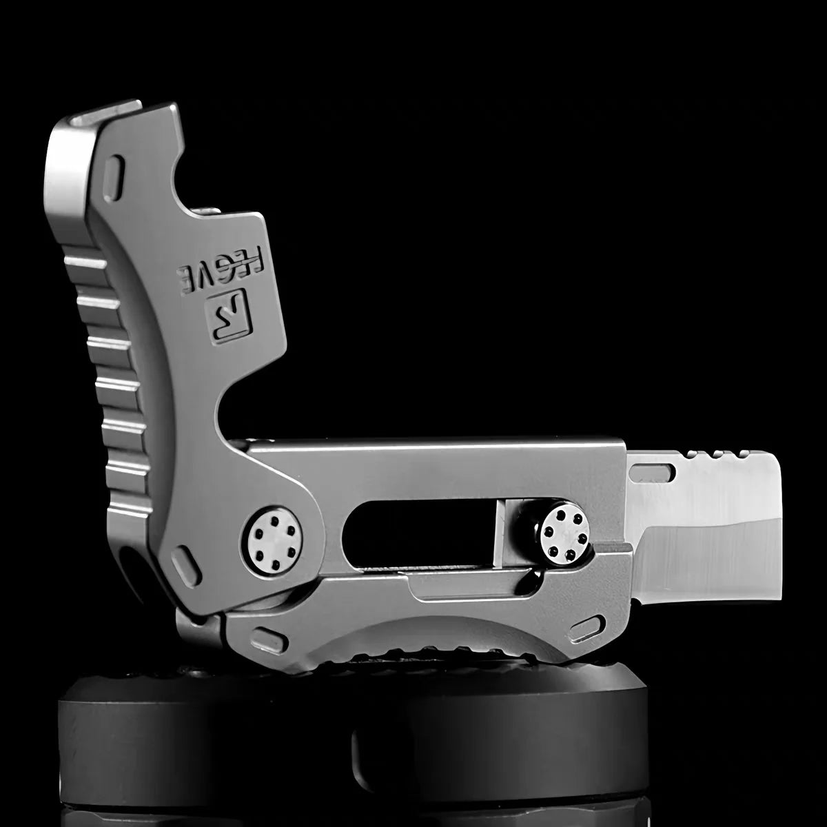 Compact Titanium Gravity‑Deploy Utility Cutter
